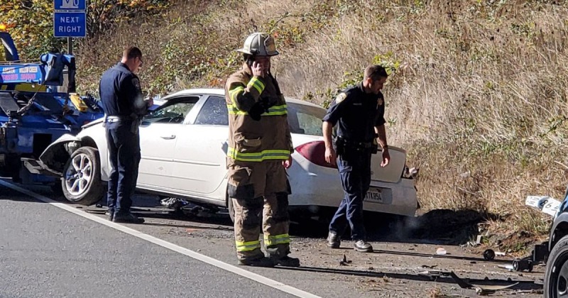 Vehicle rolls over in three-car crash in Sutton