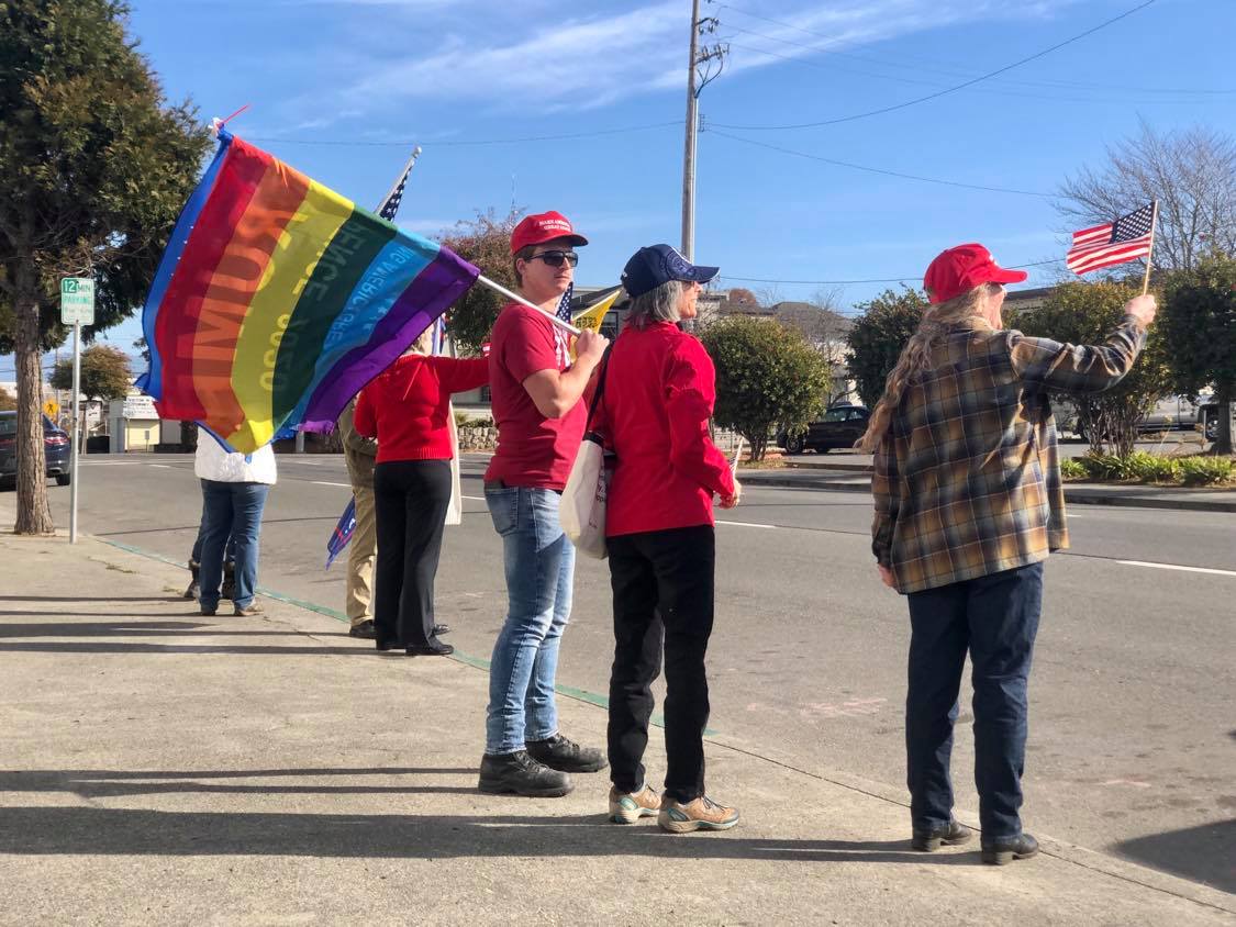 Taylor, a gay supporter of President Trump, had a Pride flag as he stood in front of the Courthouse.