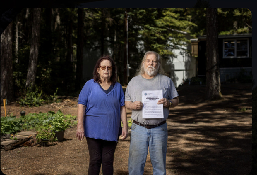 Corrine and Doug Thomas in front of their home and shop