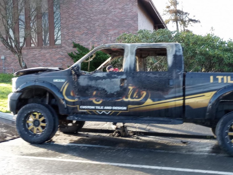 black and gold truck with burned interior