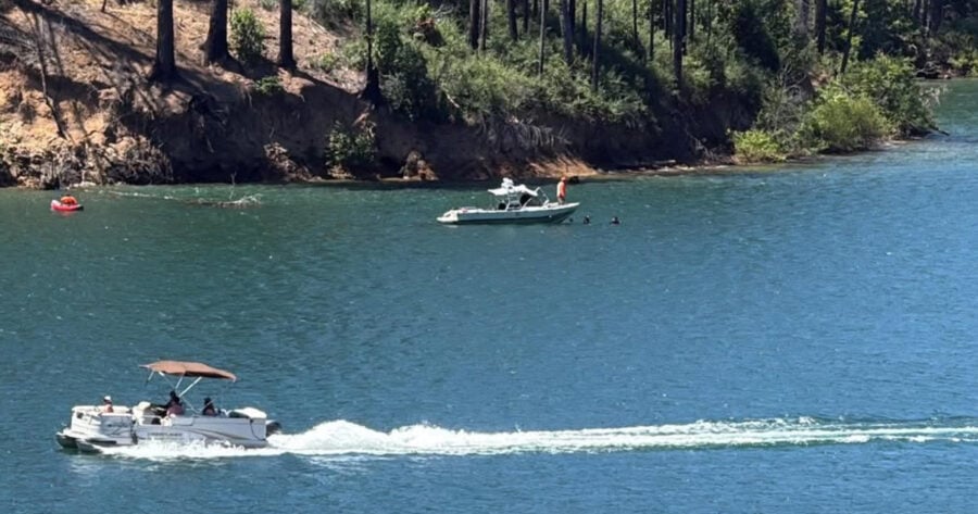 Divers search the waters near Boy Scout Cove on Ruth Lake Saturday as the Trinity County Sheriff's Office and Search and Rescue teams continue looking for a missing boater after a vessel reportedly capsized overnight. The U.S. Coast Guard assisted with an overnight aerial search before poor visibility and fuel requirements forced its helicopter to return to base. Photo courtesy of a Redheaded Blackbelt reader.