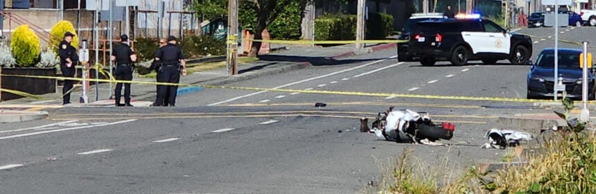 A motorcycle lies in the middle of Henderson after the crash that sent one man to the hospital with major injuries.