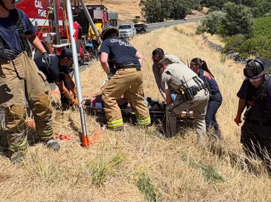 Firefighters and CHP officers conduct a technical rescue on a steep hillside after a vehicle left southbound Highway 101 and overturned south of Hopland. The driver was transported to Adventist Health Ukiah Valley with minor to moderate injuries. [Photo from CHP]