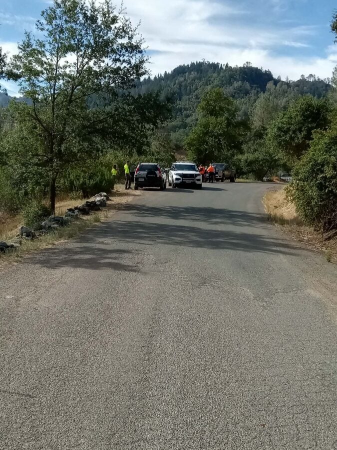 Search personnel and law enforcement gather along Highway 162 near Dos Rios during Saturday's large-scale Search and Rescue operation. Authorities asked motorists to slow down and avoid the area if possible.