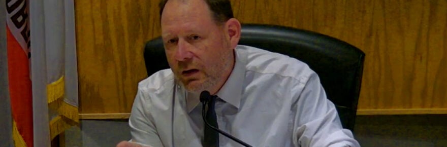 Man in shirt sleeves and a tie