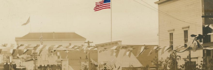 Colorized American flag on old postcard
